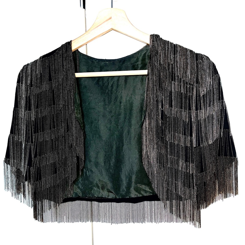 Lavish throw over, with metal beads dripping all over. Army green lining.